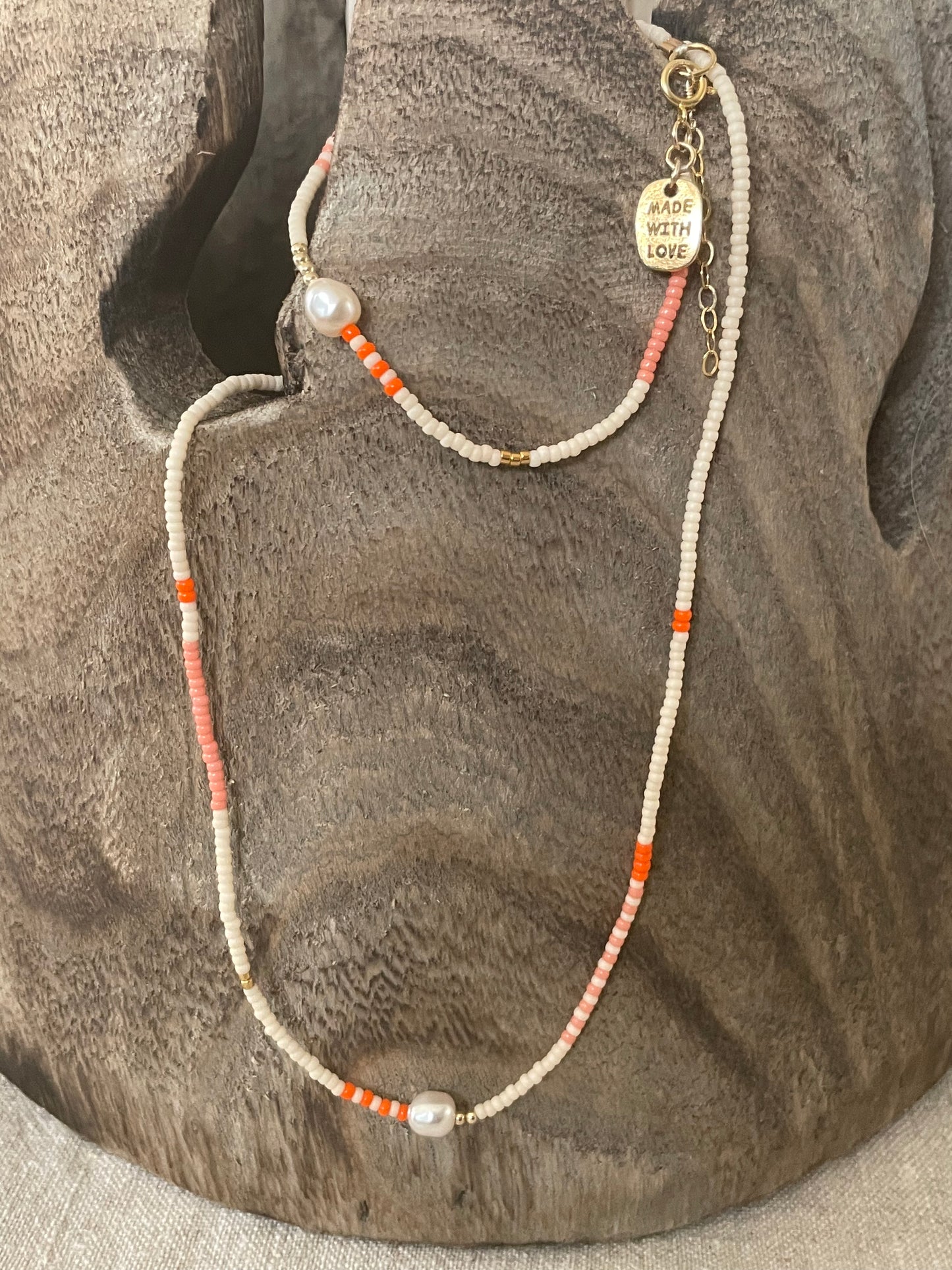 Zebra pearl collier oranje