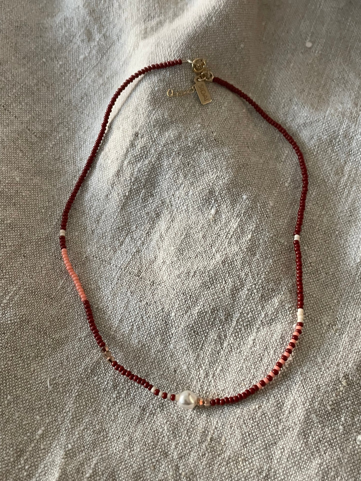 Zebra pearl crystal collier donkerrood